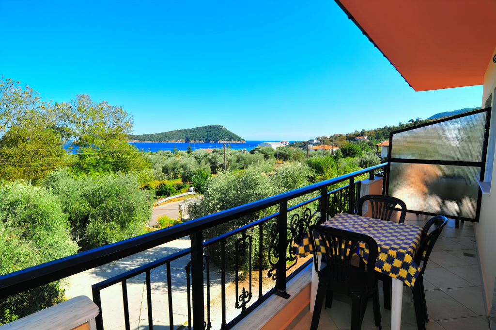 View from a Studios Betty balcony over olive trees to Kinira Bay, Thasos